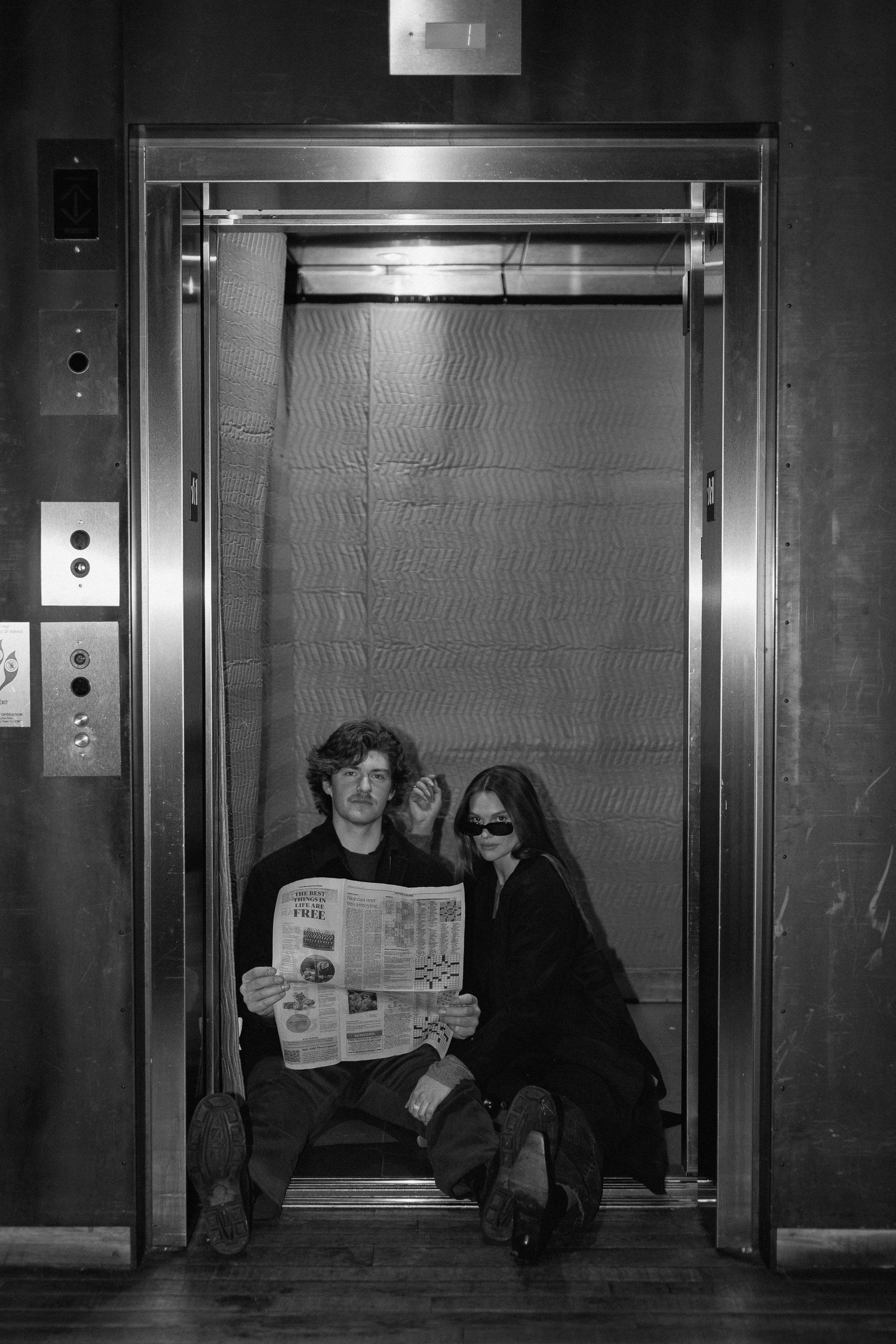 Couples session in elevator in Minneapolis, Minnesota. Captured by Makayla Miranda Photo.