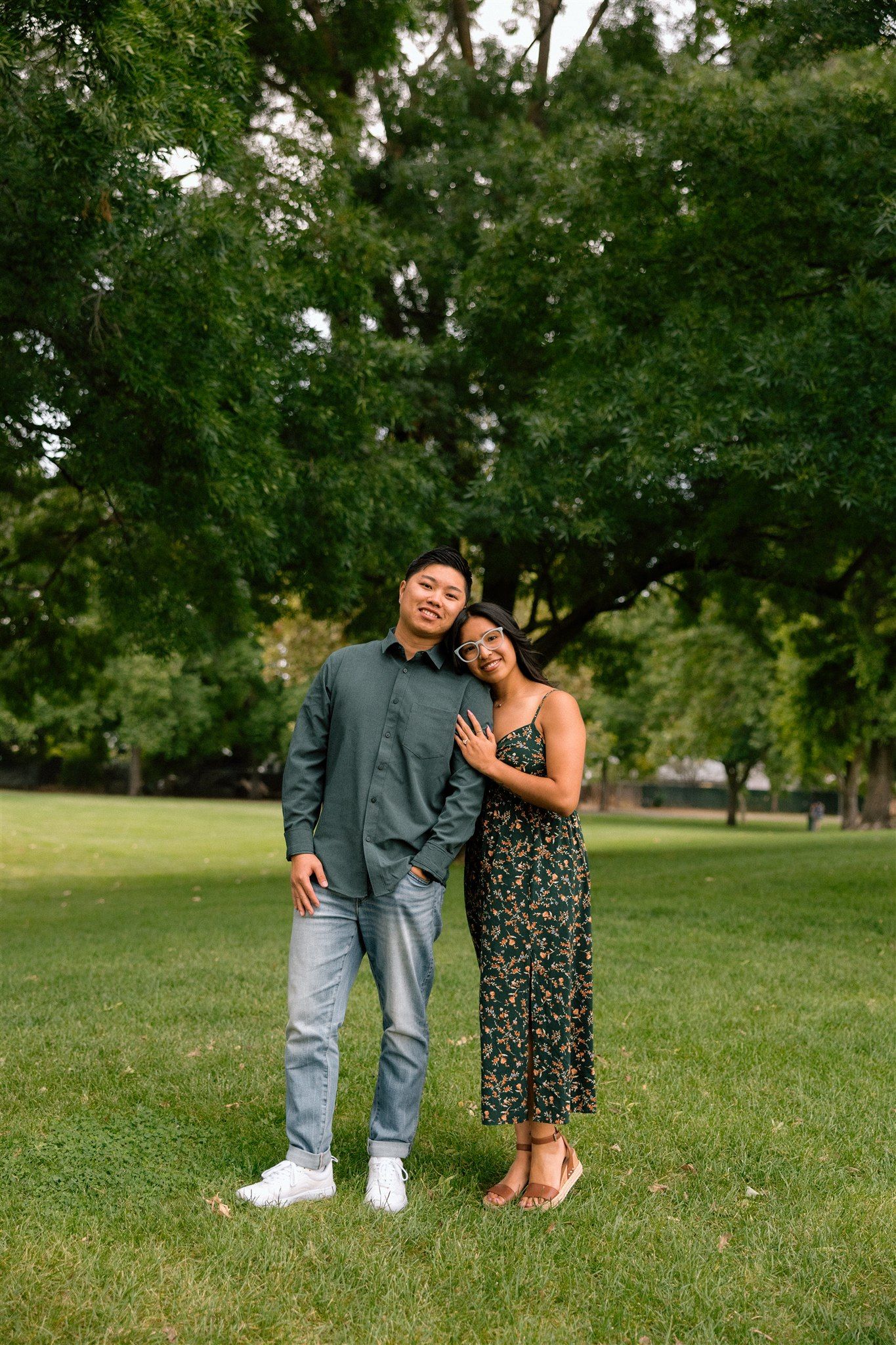 Couple enjoying their engagement session at a park in Chico, California, captured by Makayla Miranda Photo.