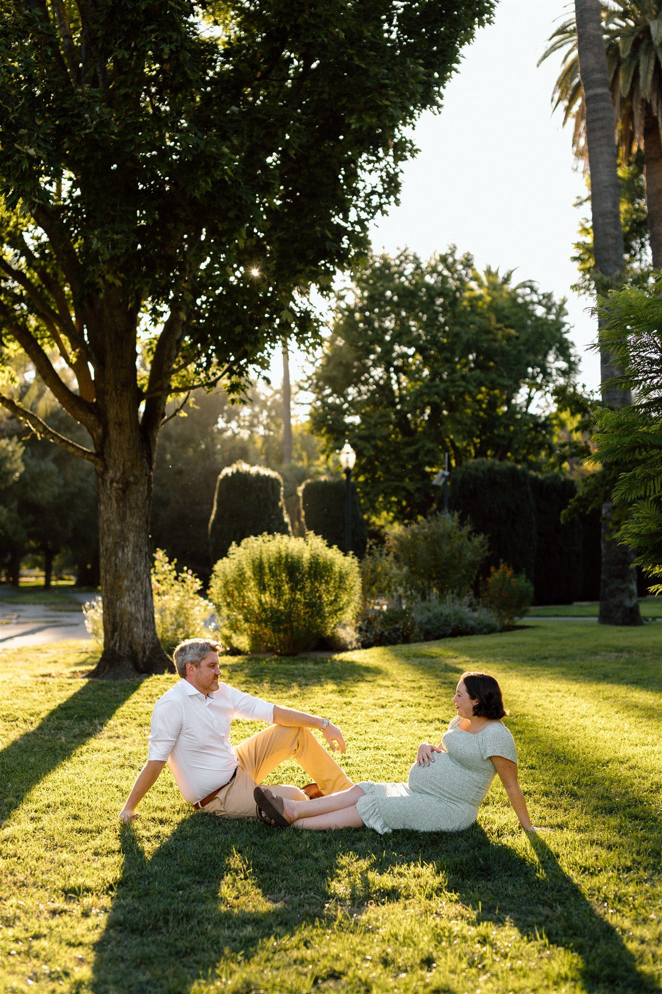 Expecting couple enjoying a maternity session outdoors in Sacramento, California, captured by Makayla Miranda Photo.