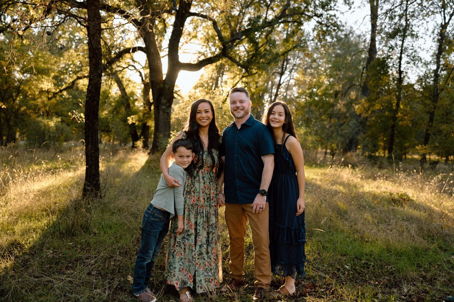 Family enjoying a golden hour portrait session outdoors in Redding, Northern California, captured by Makayla Miranda Photo.