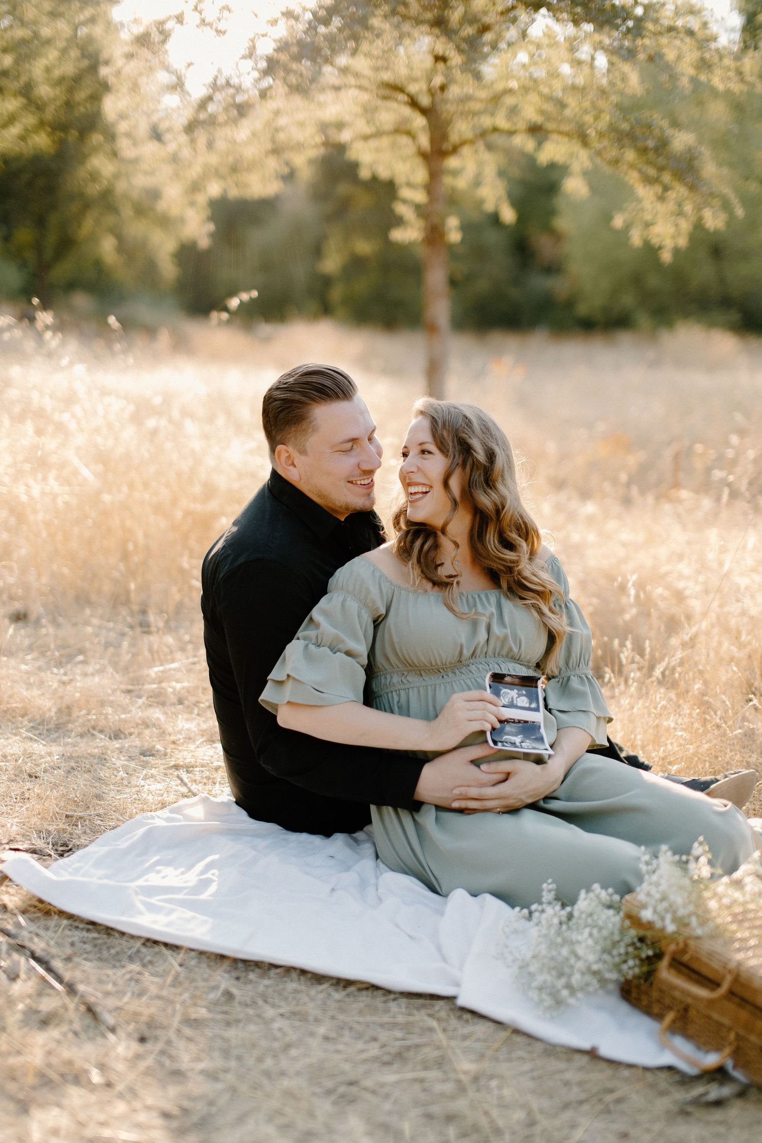 Expecting couple enjoying a golden hour maternity session outdoors in Northern California, captured by Makayla Miranda Photo.