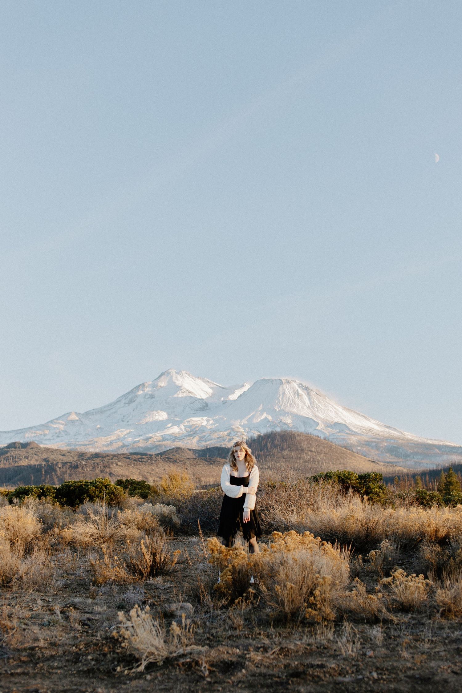 High school senior posing outdoors during a portrait session with Mount Shasta in the background, captured by Makayla Miranda Photo