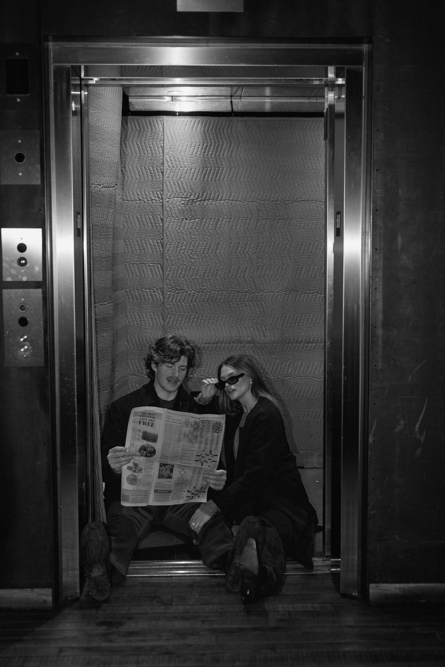 Couples session in elevator in Minneapolis, Minnesota. Captured by Makayla Miranda Photo.
