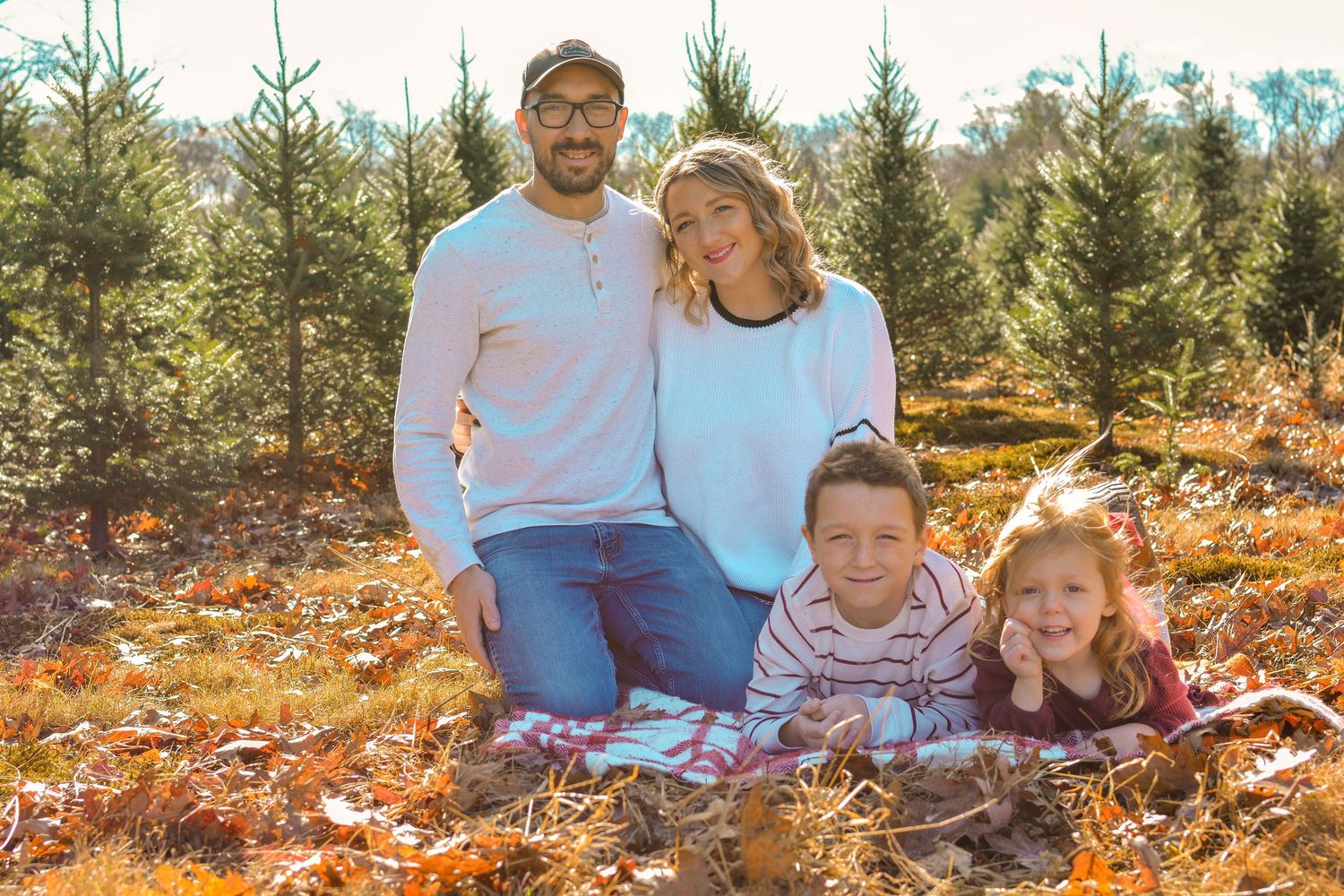 family holiday mini session. photography Christmas card session at Christmas tree farm in Central Massachusetts