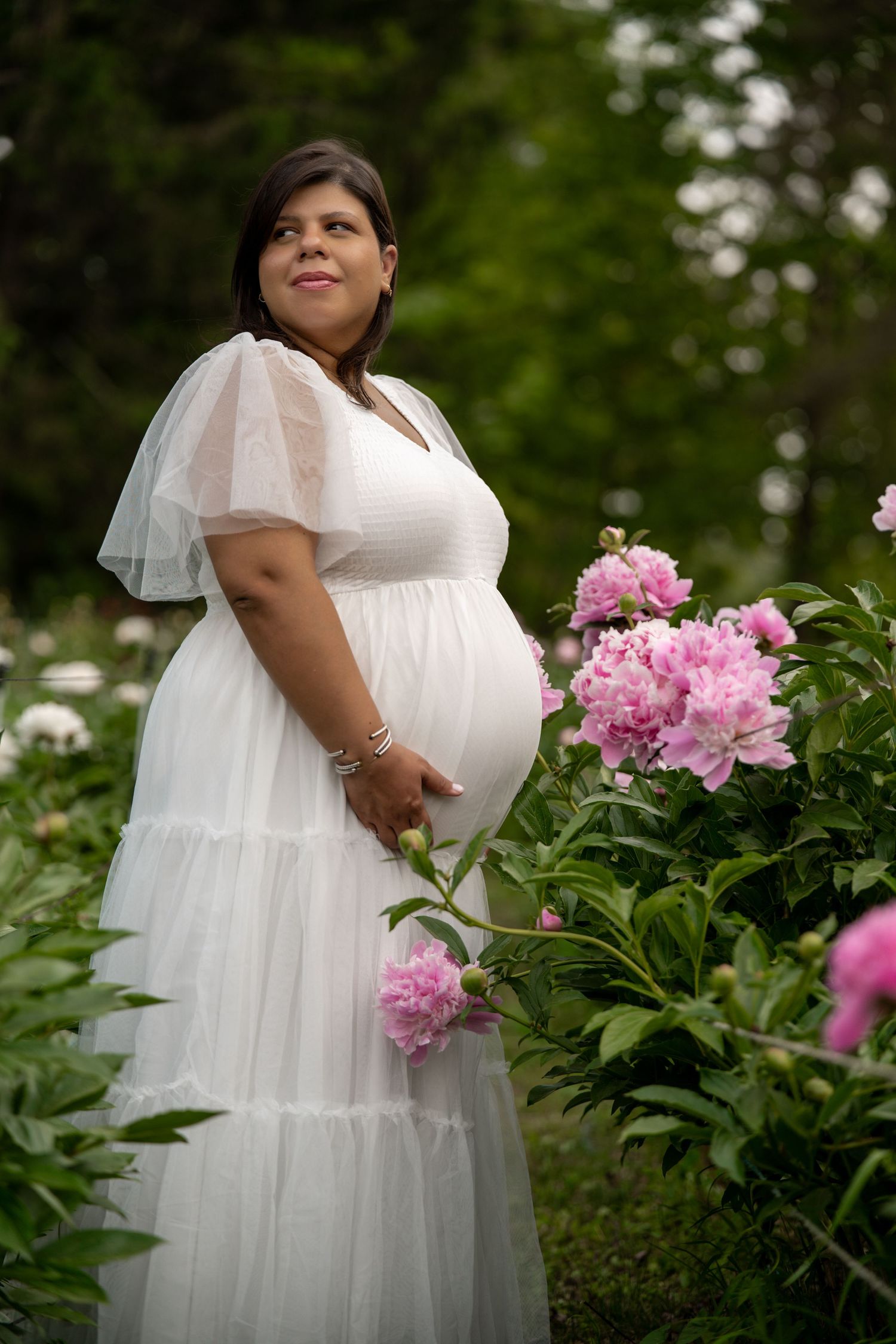 maternity photography 35 weeks pregnant posed in peony flower field in Bolton, MA at Nicewicz Farm