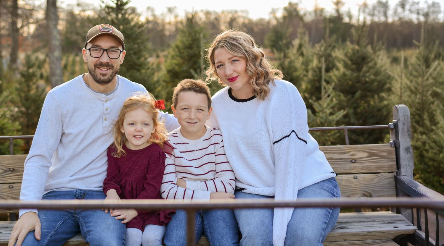 family holiday mini session. photography Christmas card session at Christmas tree farm in Central Massachusetts