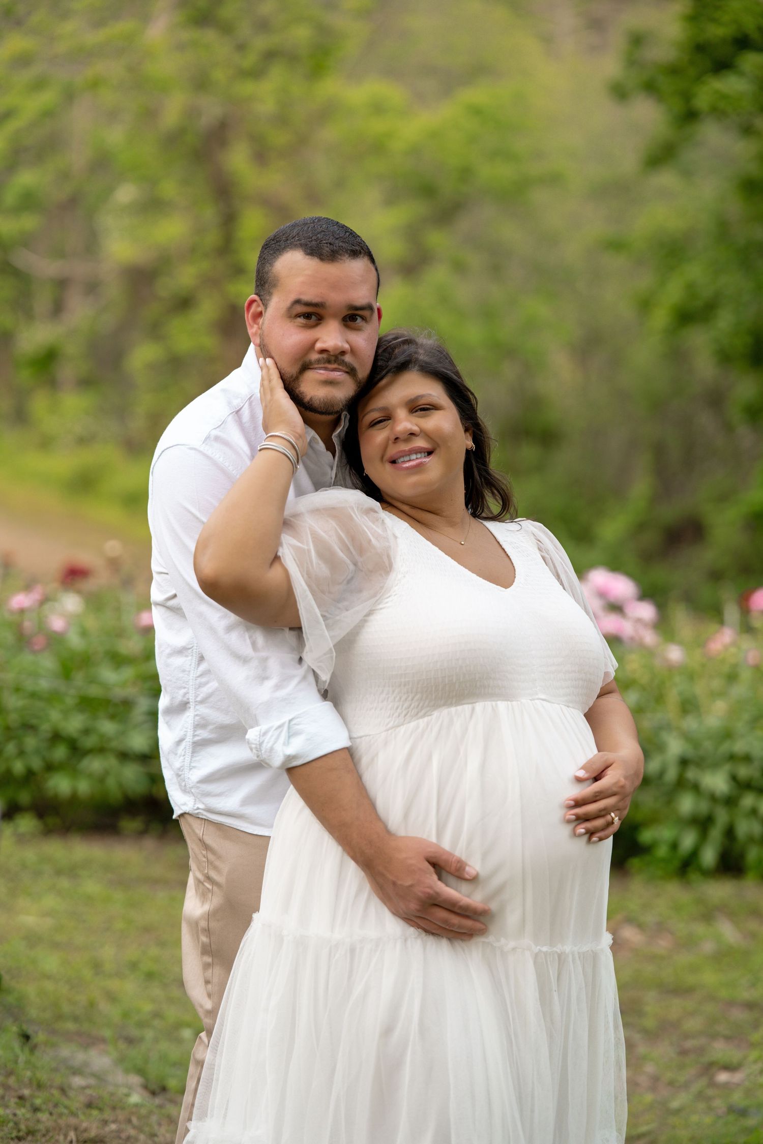 maternity photography 35 weeks pregnant posed in peony flower field in Bolton, MA at Nicewicz Farm. Studio Joki