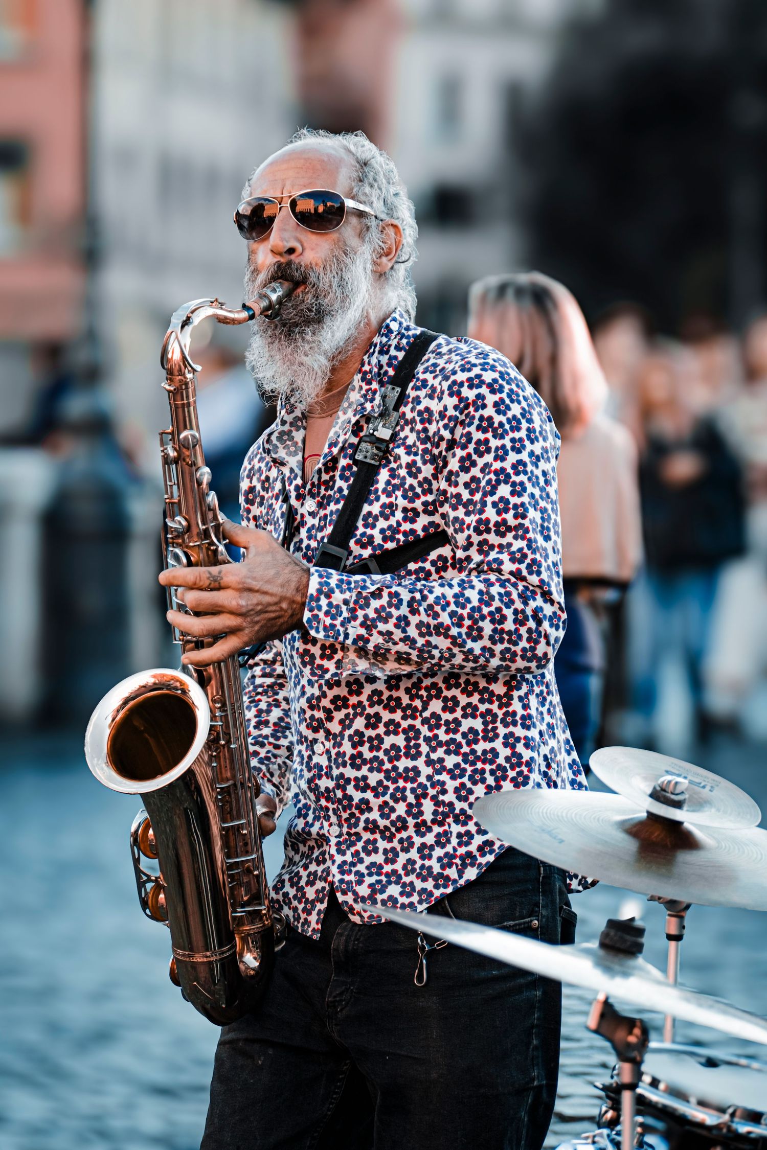 Image of a street performer playing the saxaphone