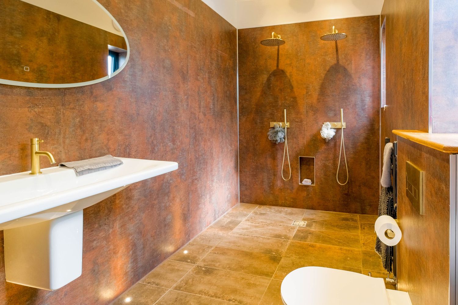 Interior photograph of boutique hotel bathroom in Manchester, showcasing warm textures and atmosphere