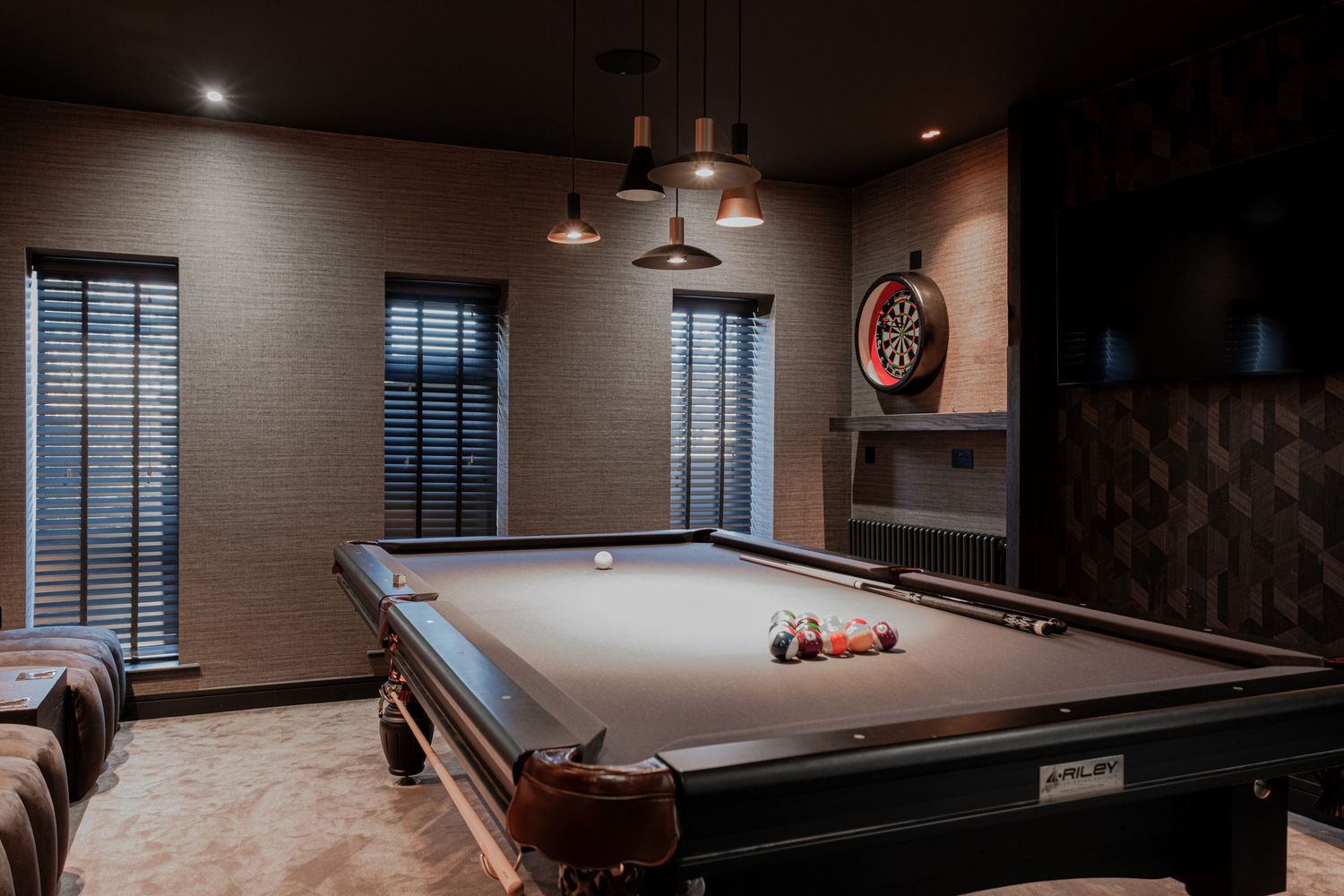 Interior photograph of the games room in an exclusive residential property in Leeds,  showcasing the designer pool table.