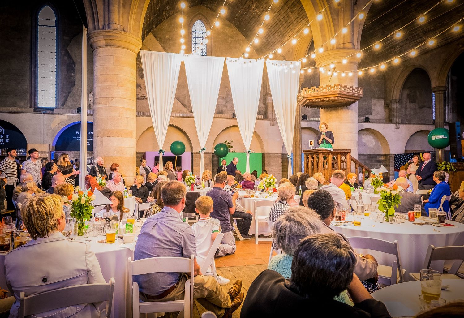 Event photograph capturing keynote speaker during charity event in West Yorkshire