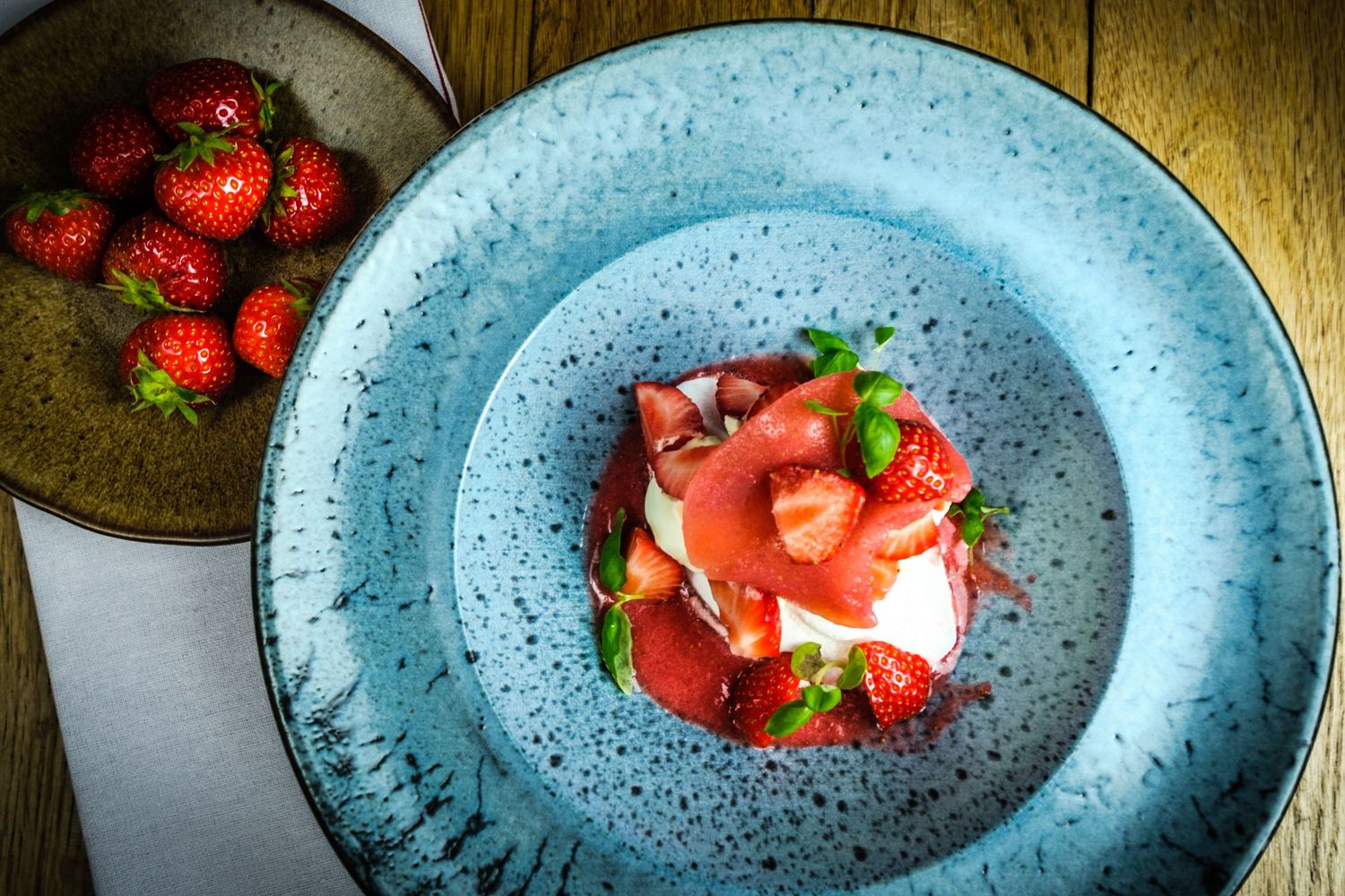 Food photograph of artisan strawberry desert in Sheffield bar, styled to highlight colour and atmosphere