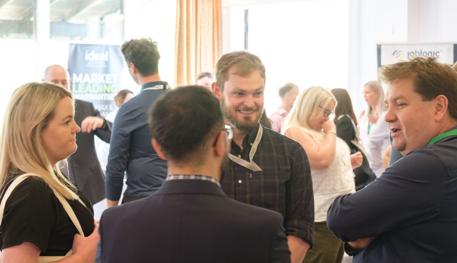 Event photograph capturing guests networking at  business conference