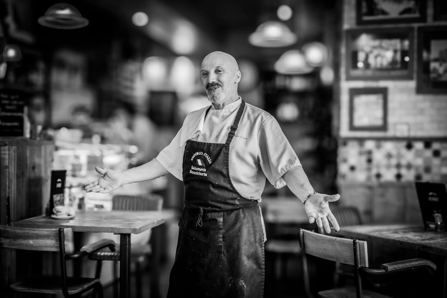 Professional portrait of chef in restaurant kitchen, photographed for promotional use