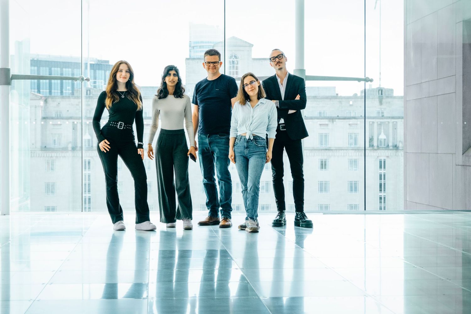 Professional portrait of a team of marketing professionals in a stylish office block in Leeds, photographed for branding and marketing