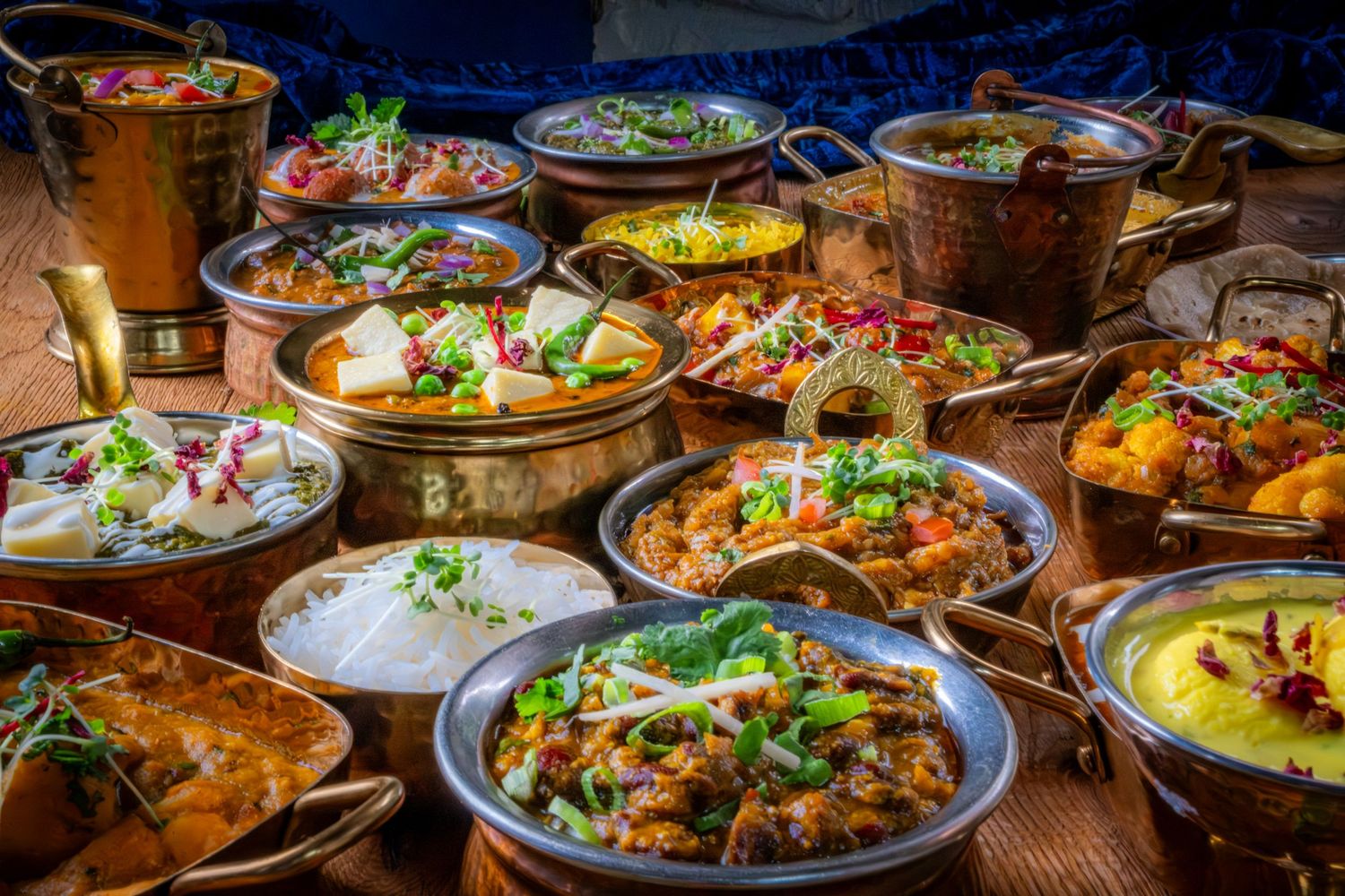 Food photograph of a selection of delicious Indian dishes in a Roundhay restaurant, styled to highlight texture and presentation
