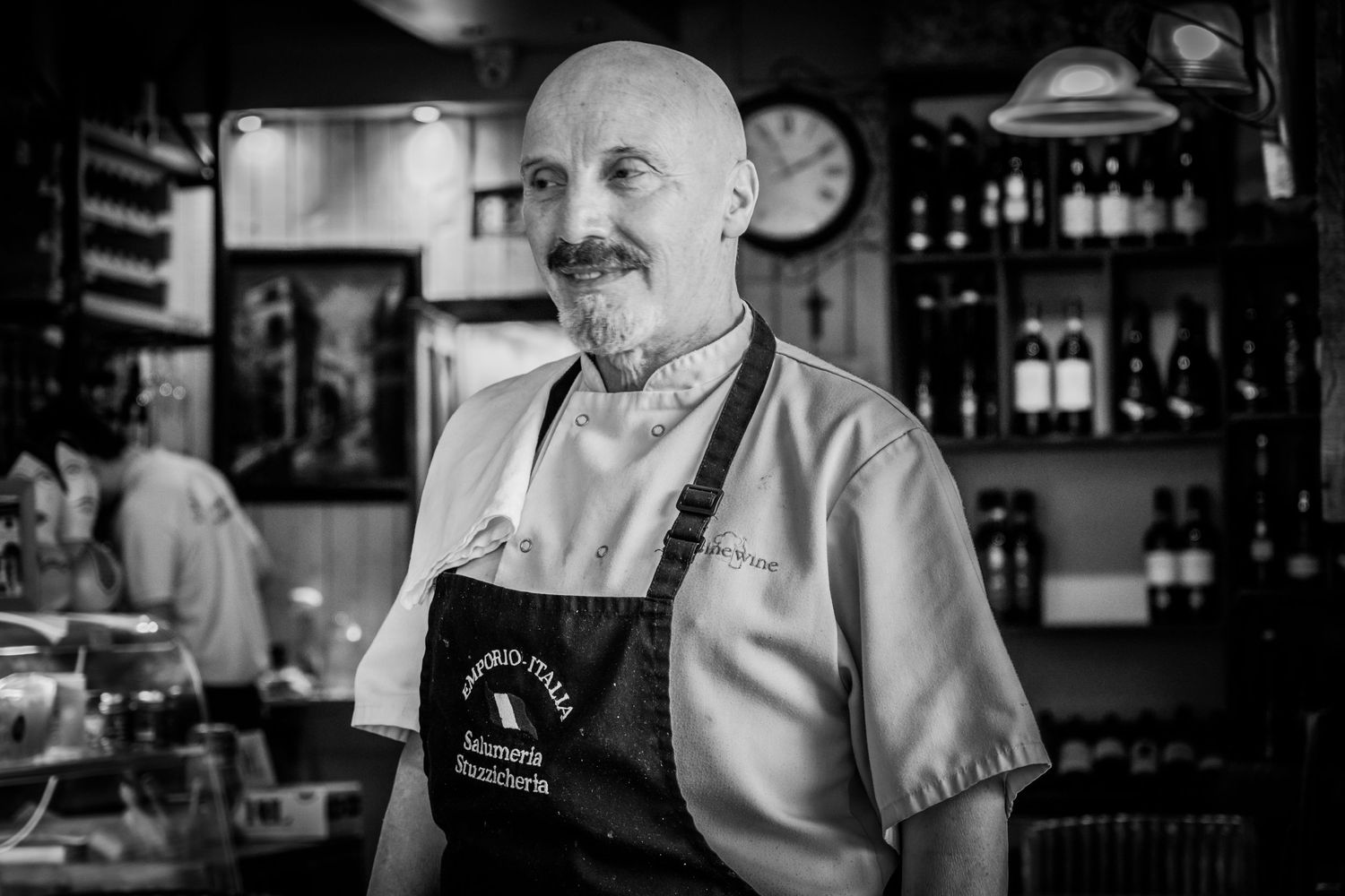 black and white image capturing the personality of a chef in his restaurant