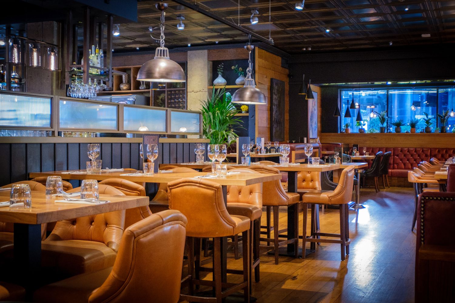 Interior photograph of  an exclusive boutique hotel restaurant in Leeds City Centre, showcasing warm textures and atmosphere