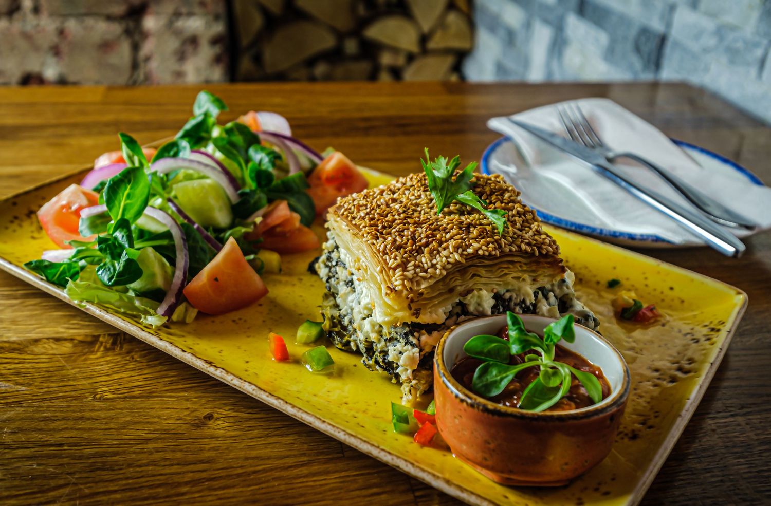 Food photograph of Greek dish at a Harrogate restaurant, styled to highlight texture and presentation