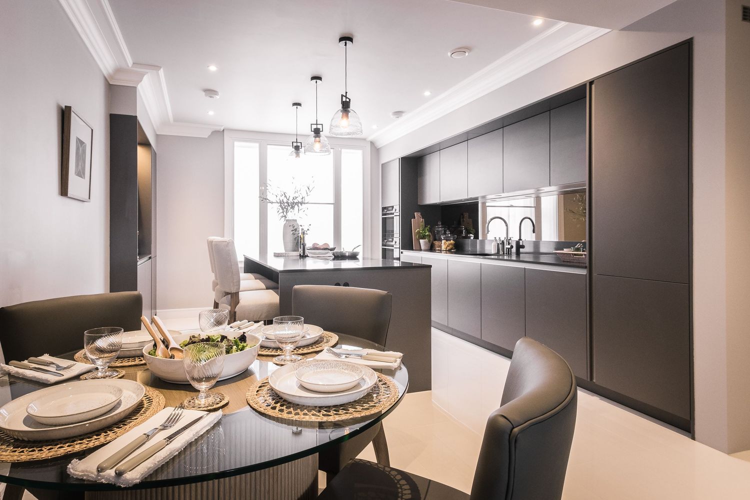 Interior photograph of a designer kitchen in an elegent apartment in York, showcasing the soft calming tones