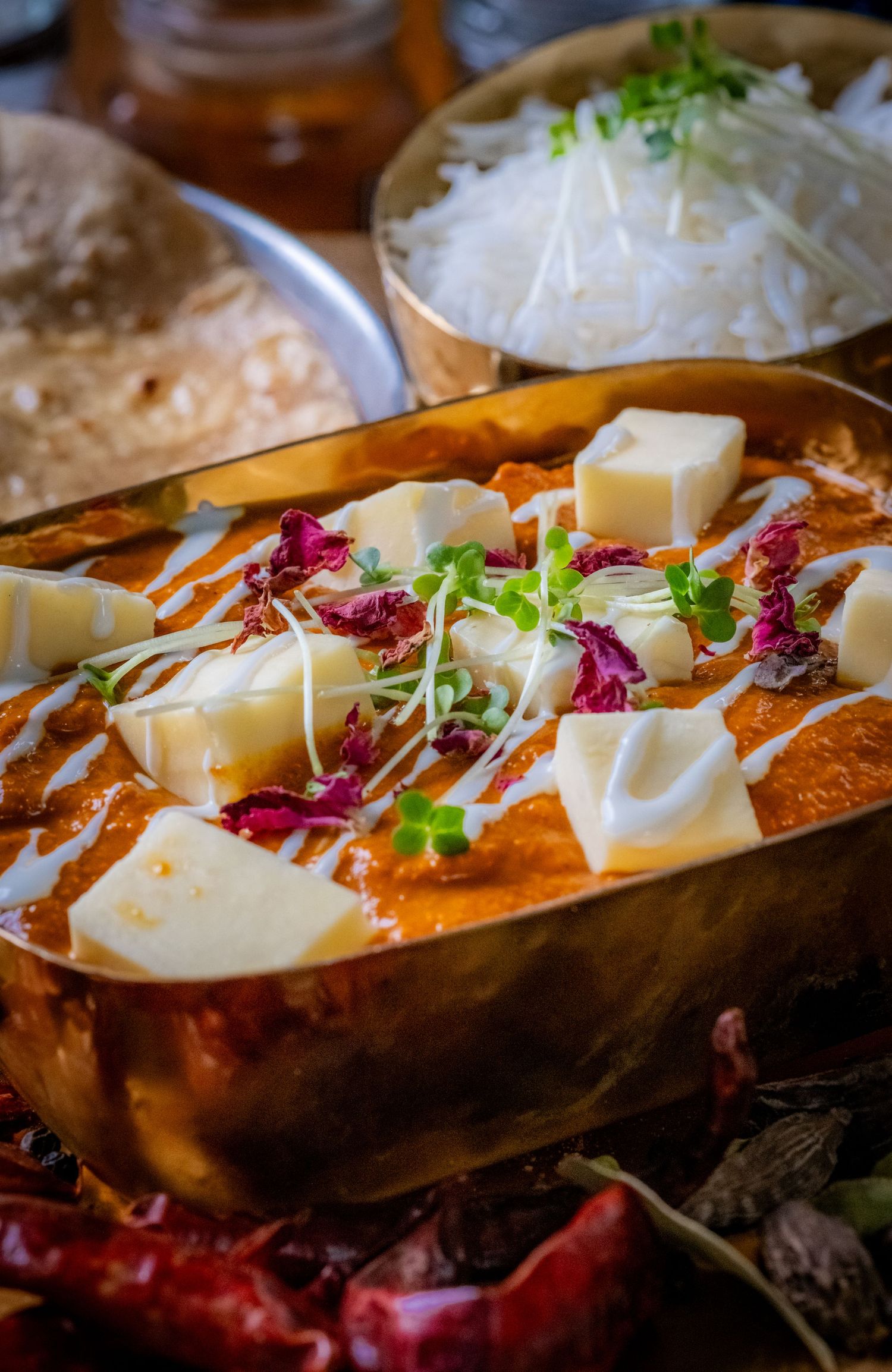 Food photograph of a selection of delicious Indian dishes in a North Leeds restaurant, styled to highlight texture and presentation