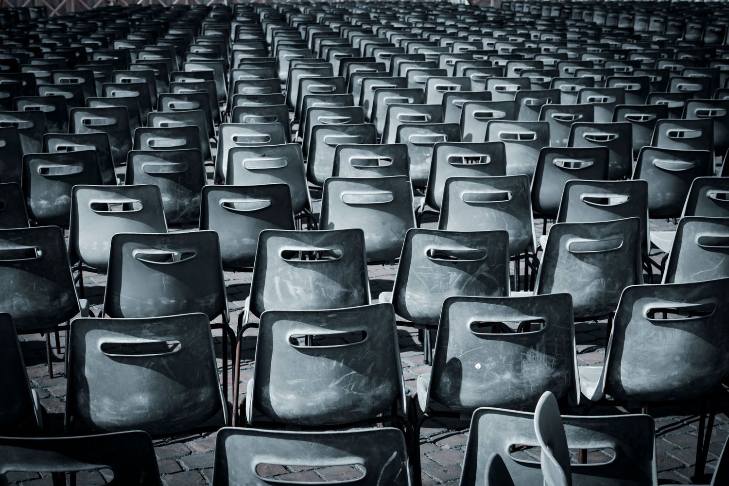 Rows of empty chairs at an event
