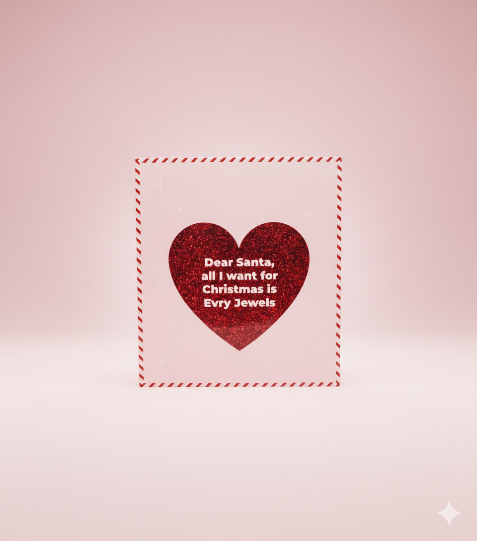 Red glitter heart on pink background reads Dear Santa all I want for Christmas is Evry Jewels.