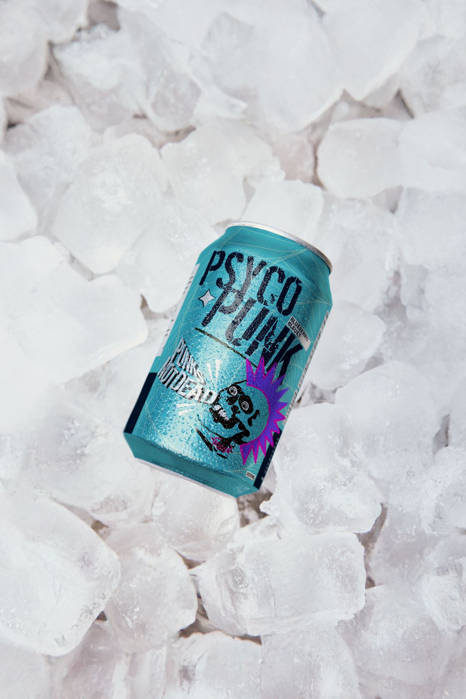 Psyco Punk energy drink can chilling on a bed of ice cubes, teal blue can with purple punk design.