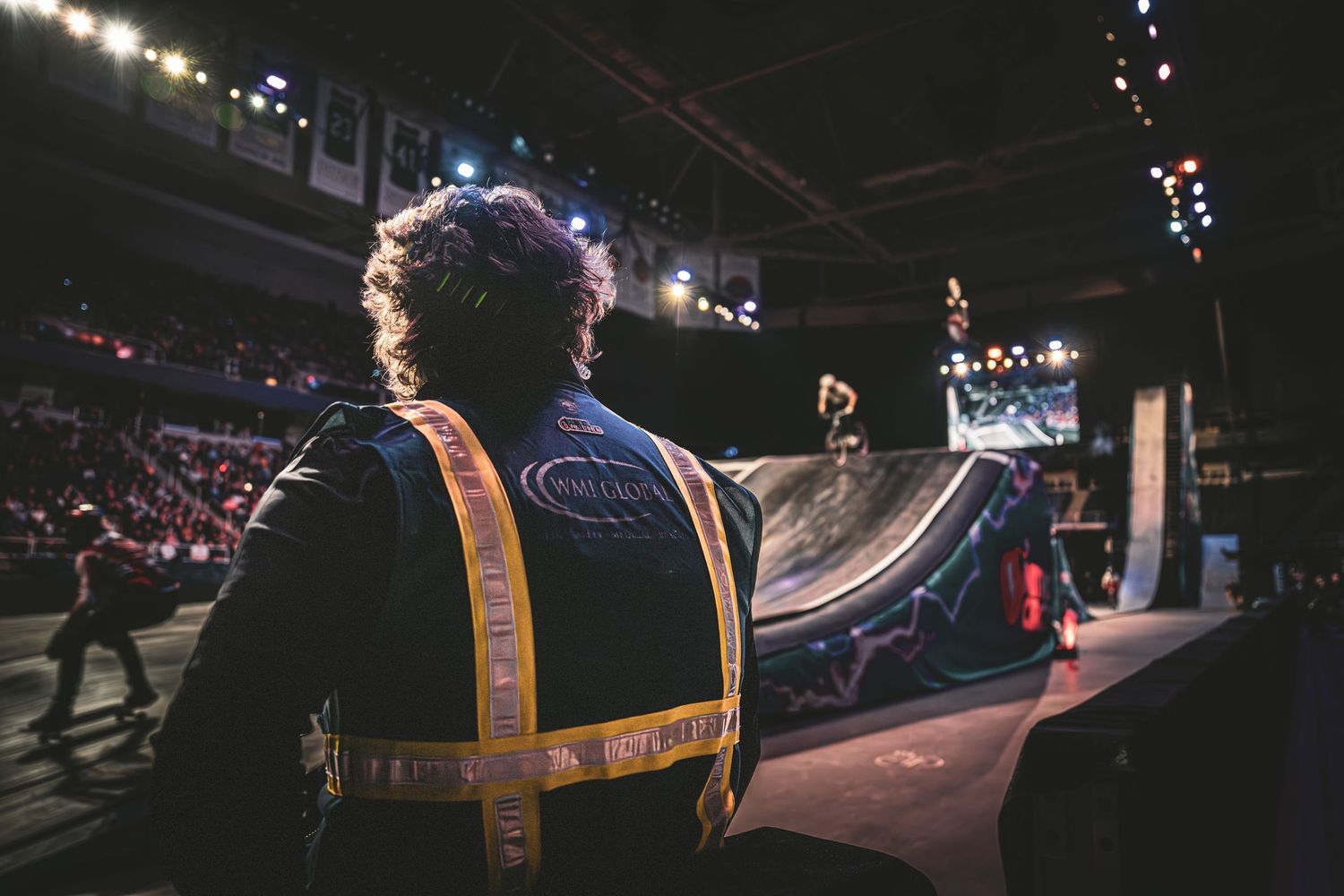 Dr. Kelly watches a skateboarder on a ramp at Nitro Circus.