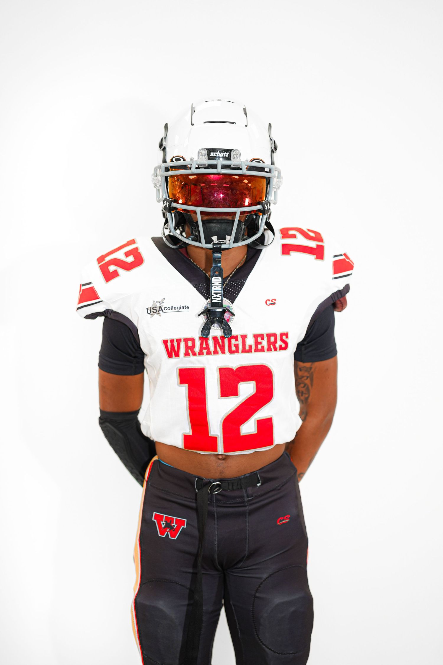 Football player wearing a white Wranglers #12 jersey and helmet with red visor posing against white background.