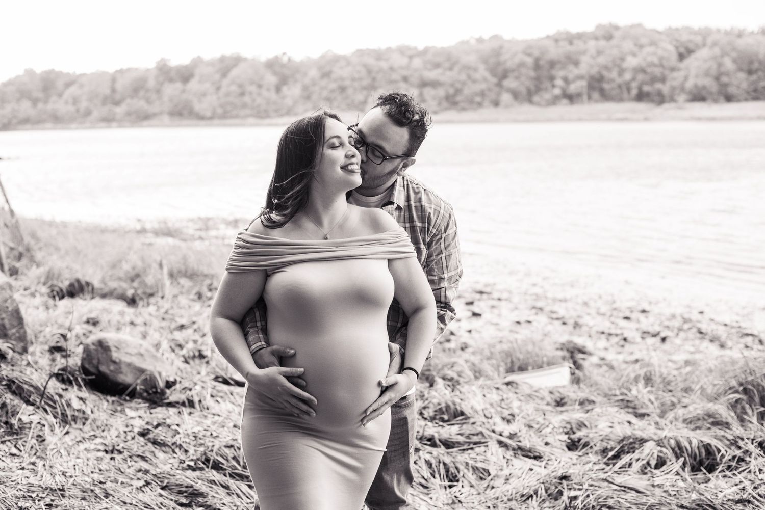 A black and white photo series captures a maternity session outdoors with soft natural lighting and scenic backgrounds.