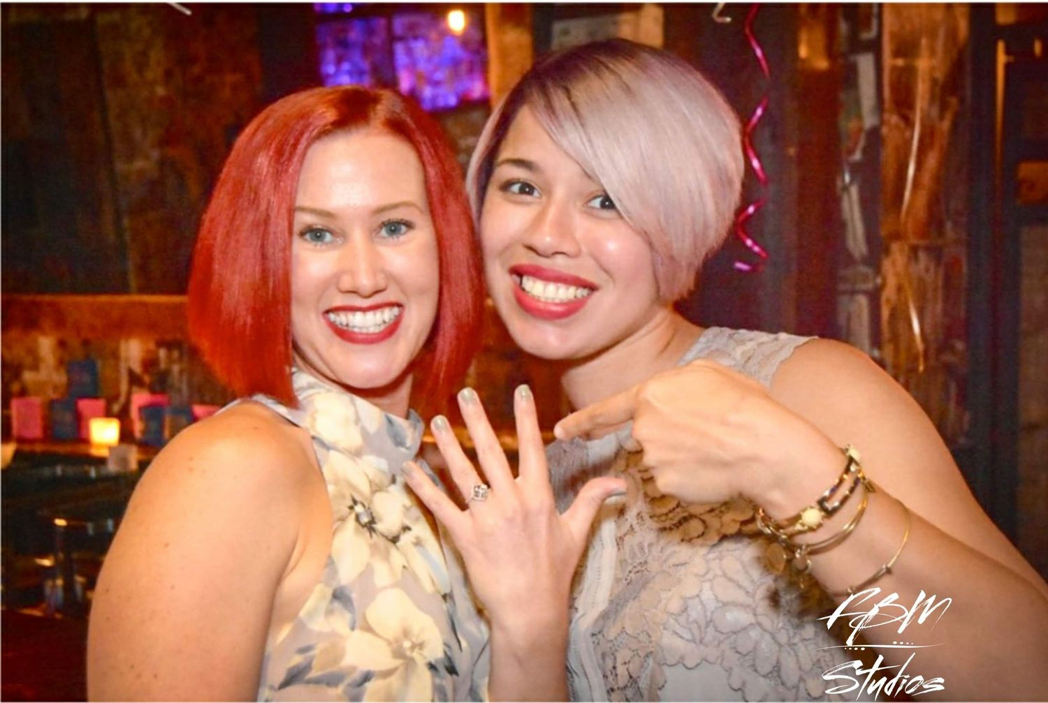 lgbq+ showing off engagement ring at celebration party by FBM Studios in Ft Lauderdale Fl.
