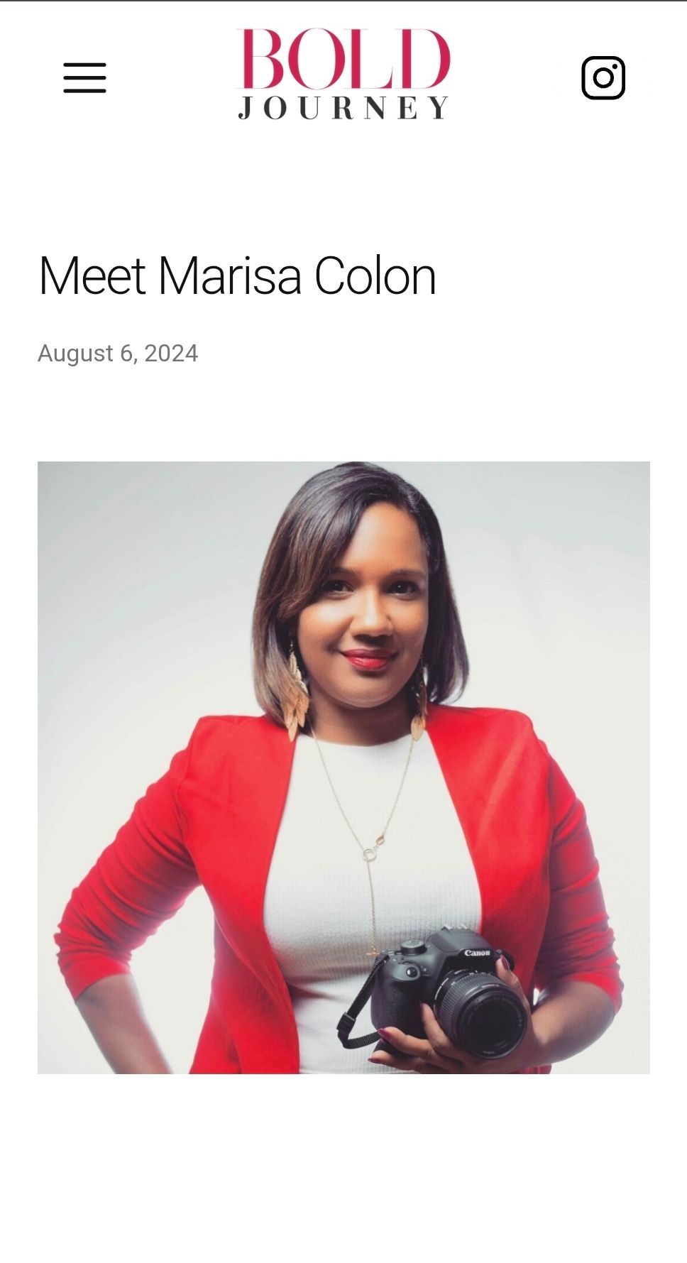 Woman in red blazer holding Canon camera smiles confidently for Bold Journey feature portrait dated August 6, 2024. by FBM Studios in FL