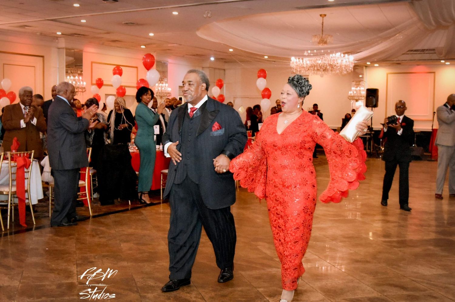 Wedding reception dance floor with red balloon decorations and formal attire by FBM Studios in Ft Lauderdale Fl.