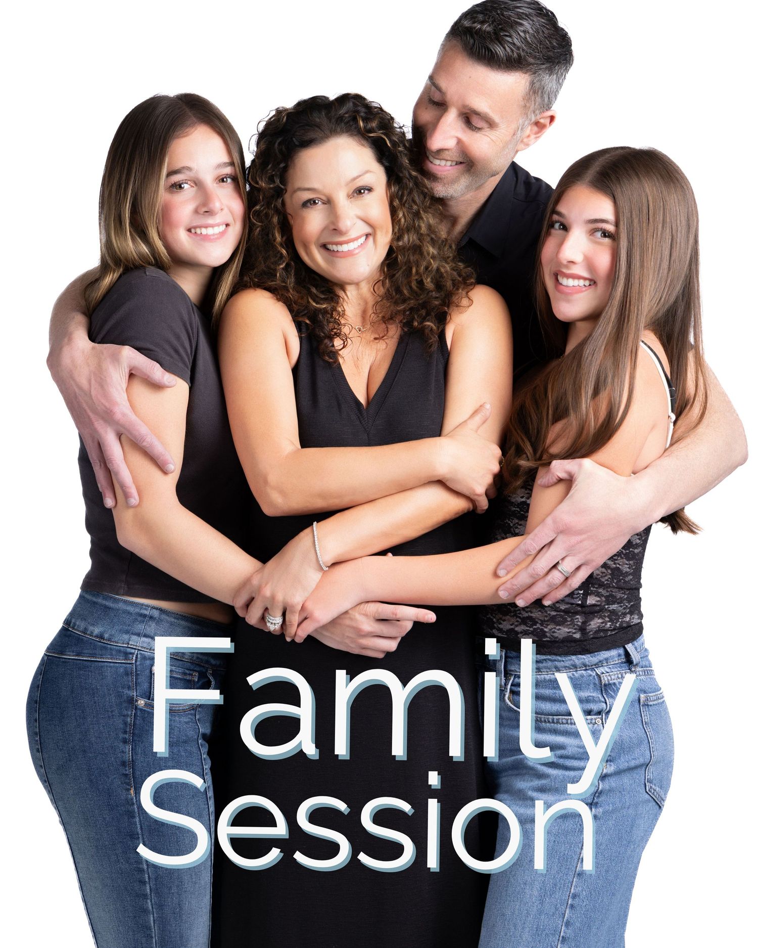 Family of four smiling and embracing during a professional family portrait session against a white background.