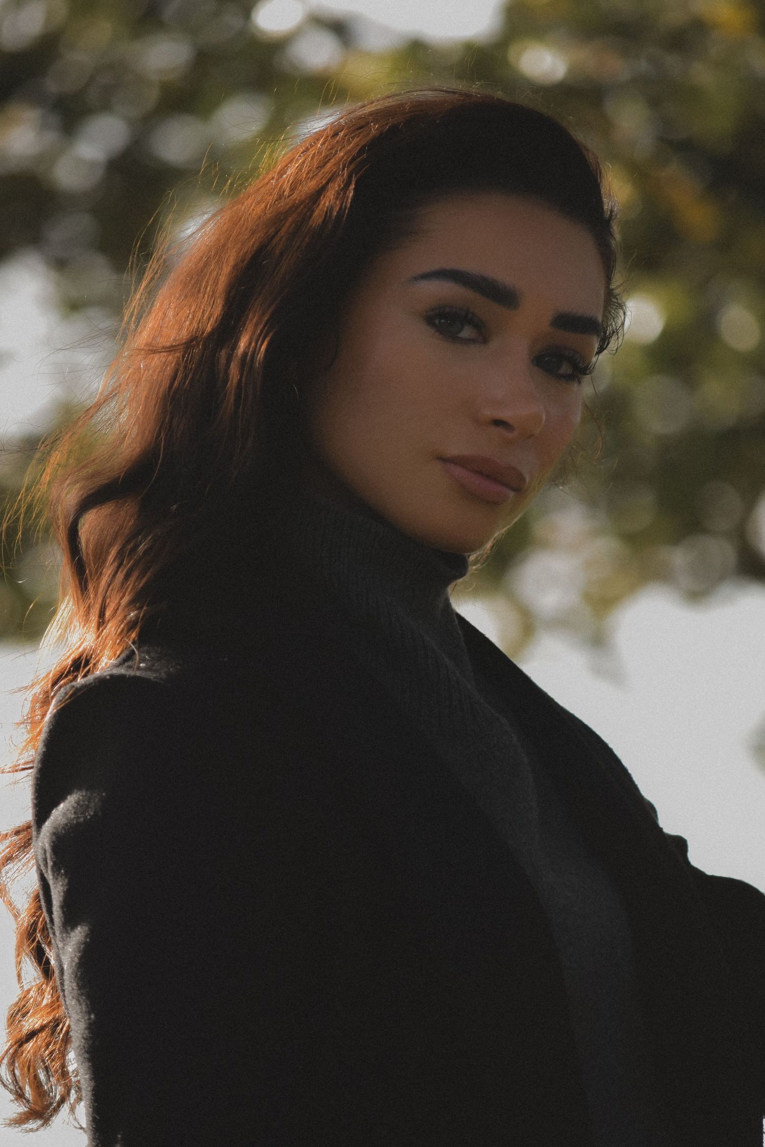 Portrait photo of a woman who is modelling in the countryside