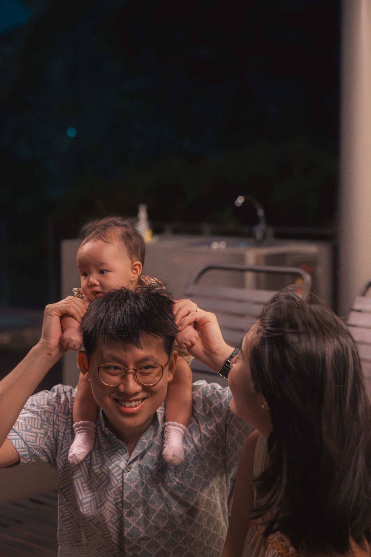 A series of candid shots showing joyful laughter and playful expressions during a casual conversation outdoors at dusk.