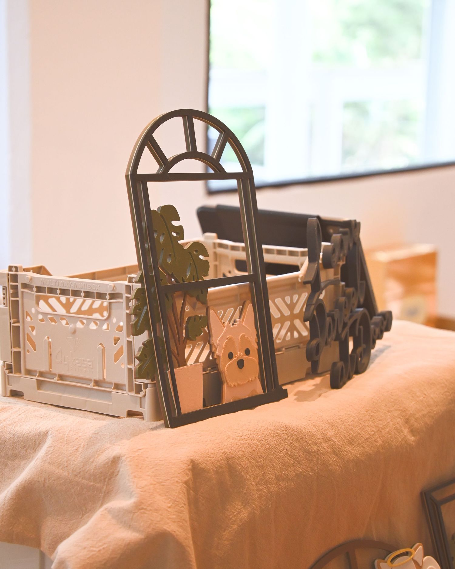 Row of decorative metal or wooden display frames on a white surface.