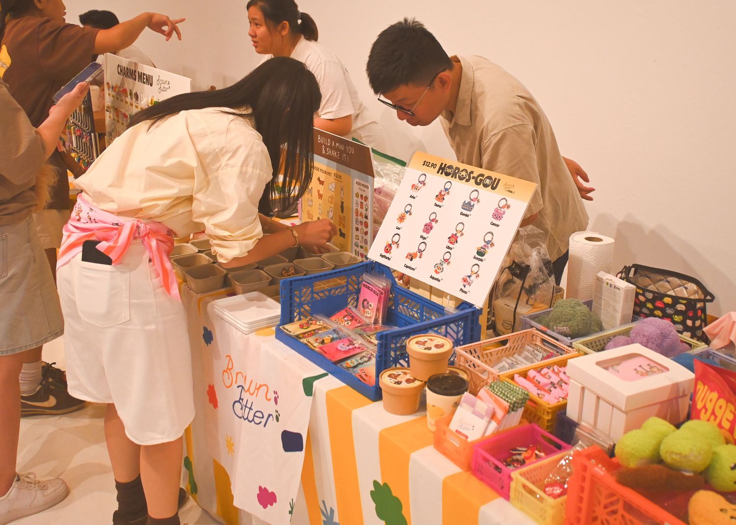 Retail market scene with vendors selling packaged goods and snacks.