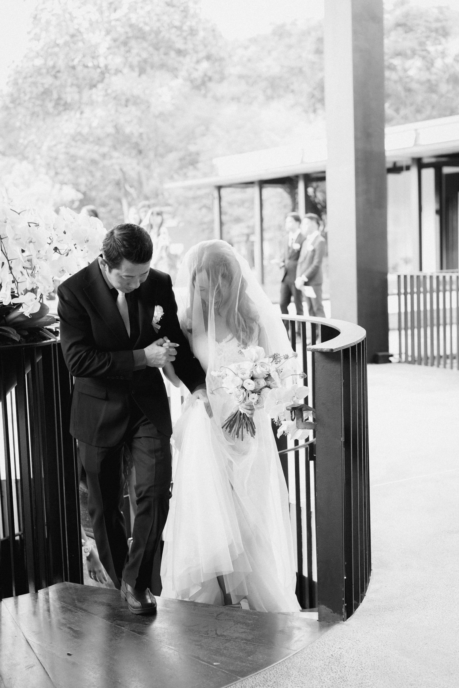 A romantic sequence of wedding photos showing a couple dancing and sharing intimate moments under a covered porch.