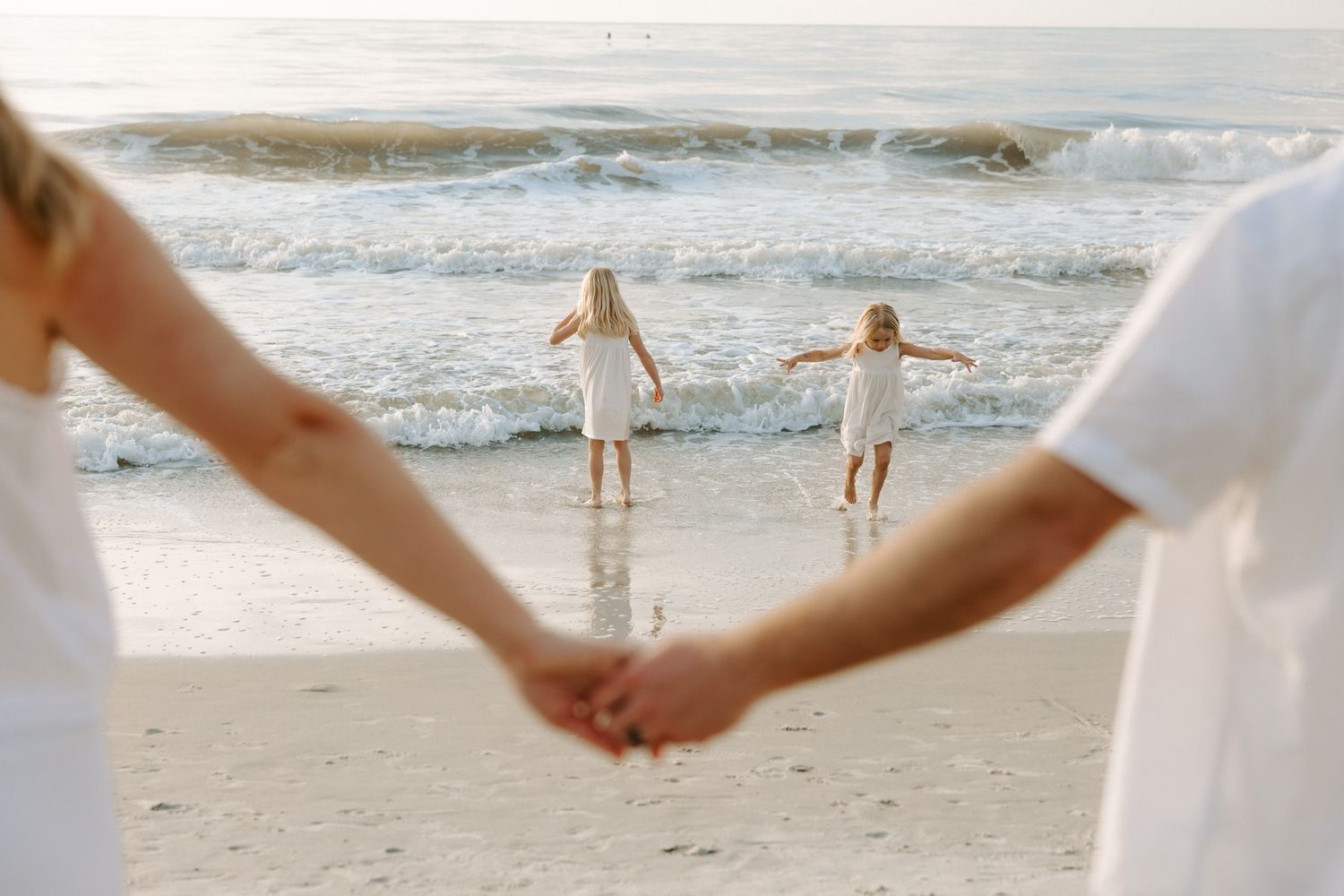 Family photography session at Hilton Head Island beach during sunrise