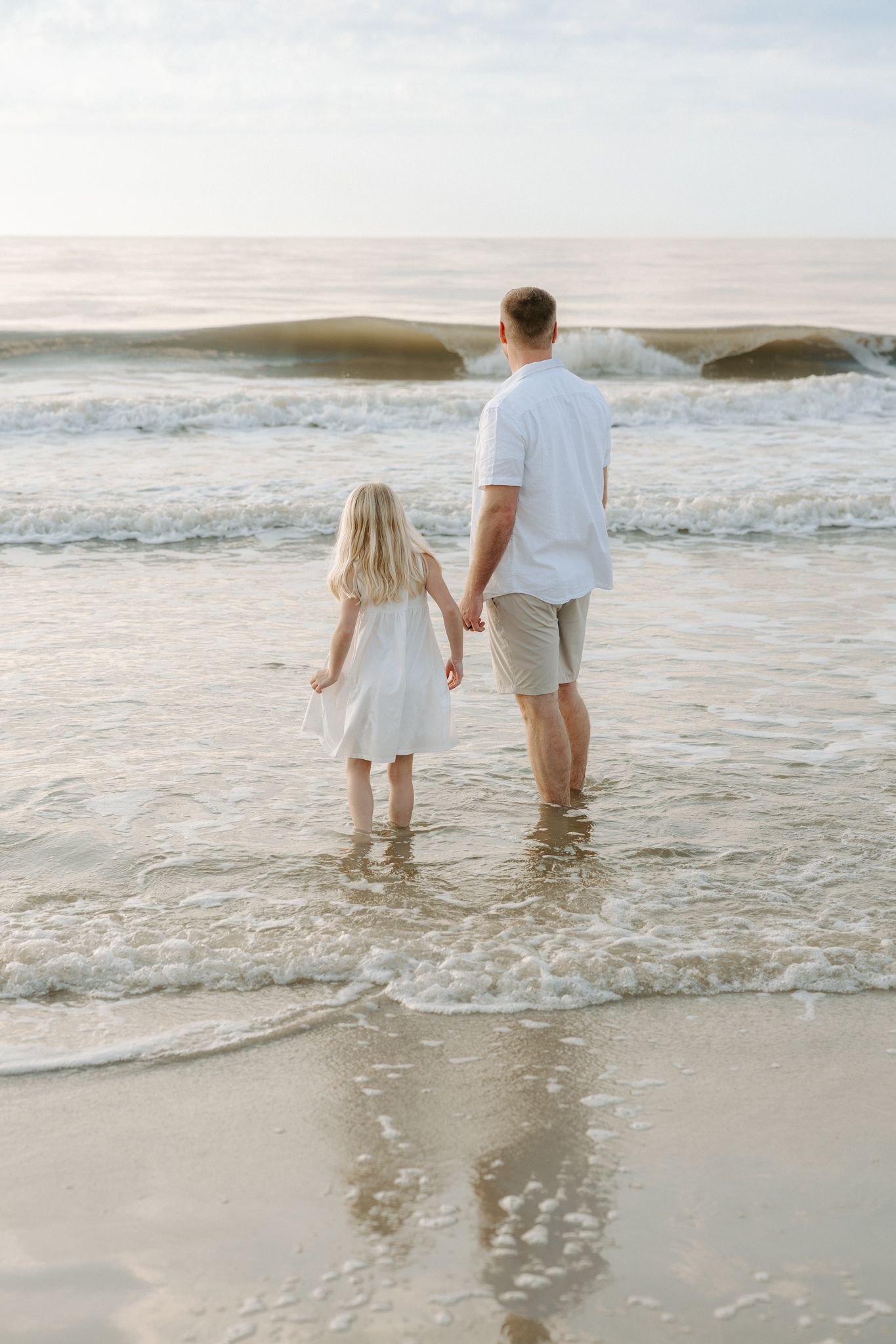 Family photography session at Hilton Head Island beach during sunrise