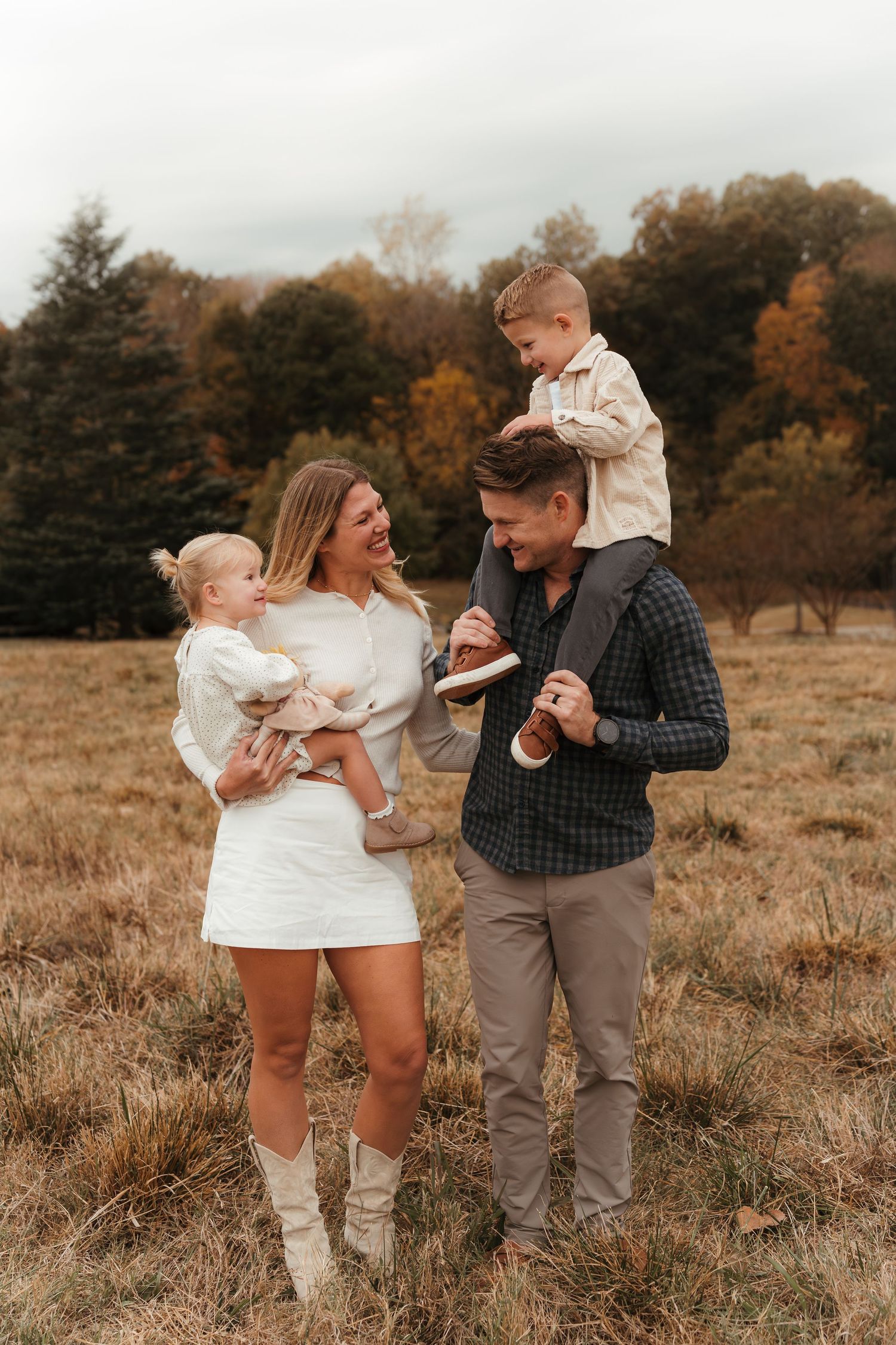 Family cuddled together in this Fort Mill, SC outdoor session.