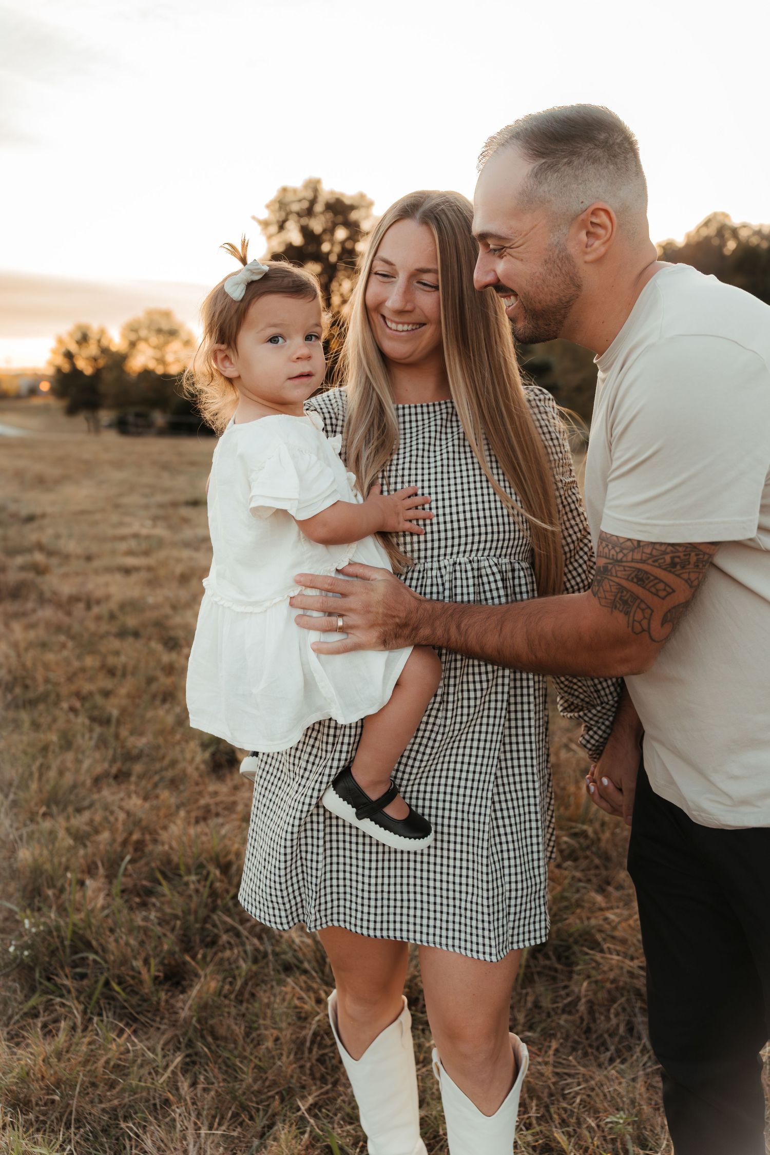 Parents hugging their little girl in Fort Mill, SC lifestyle family session.
