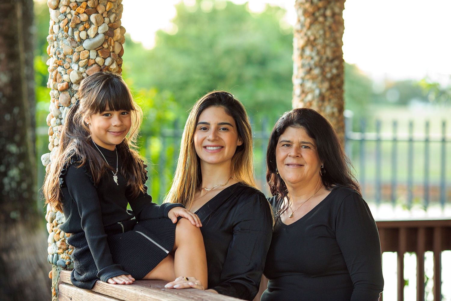 Three generation family portrait captured during an outdoor photography session