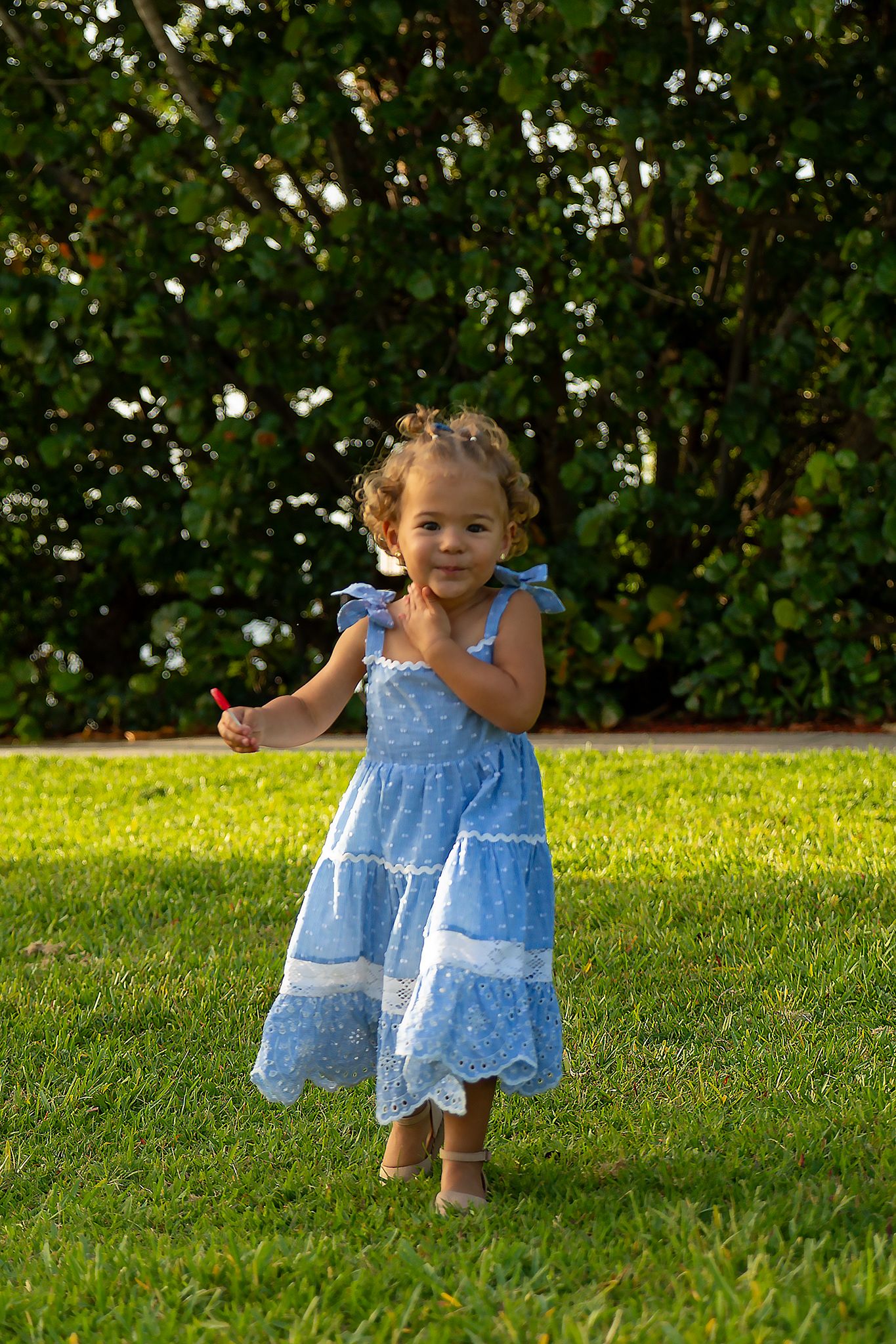 Little girl standing outdoors during a natural kids photography session