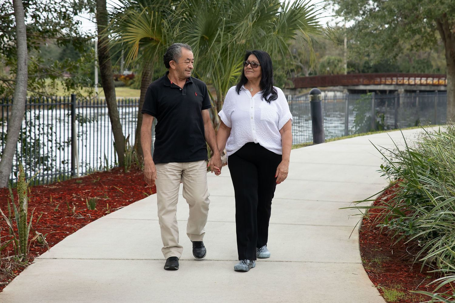 Couple walking together during a natural outdoor portrait photography session