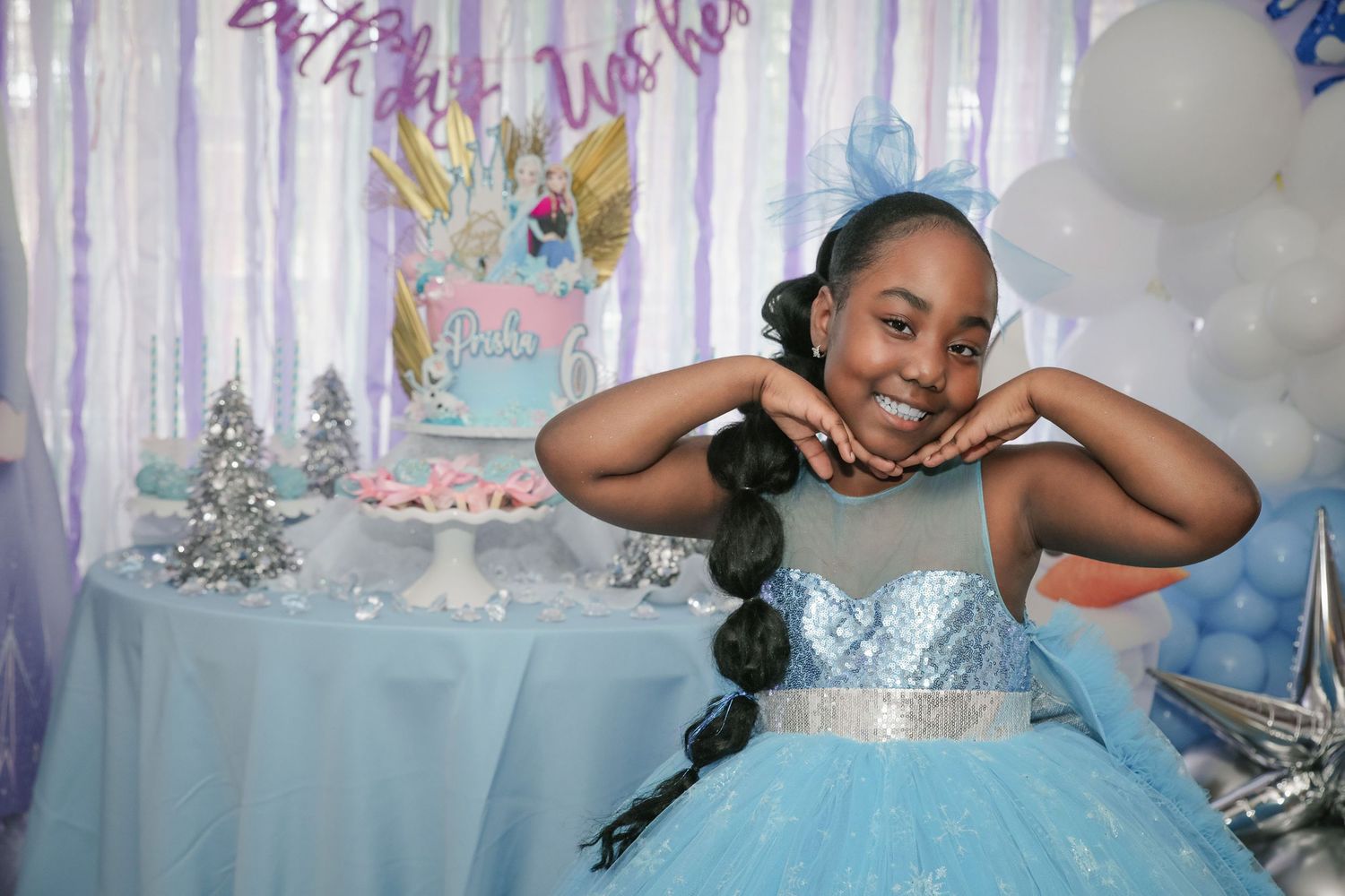 Little girl smiling during a princess themed birthday photography session