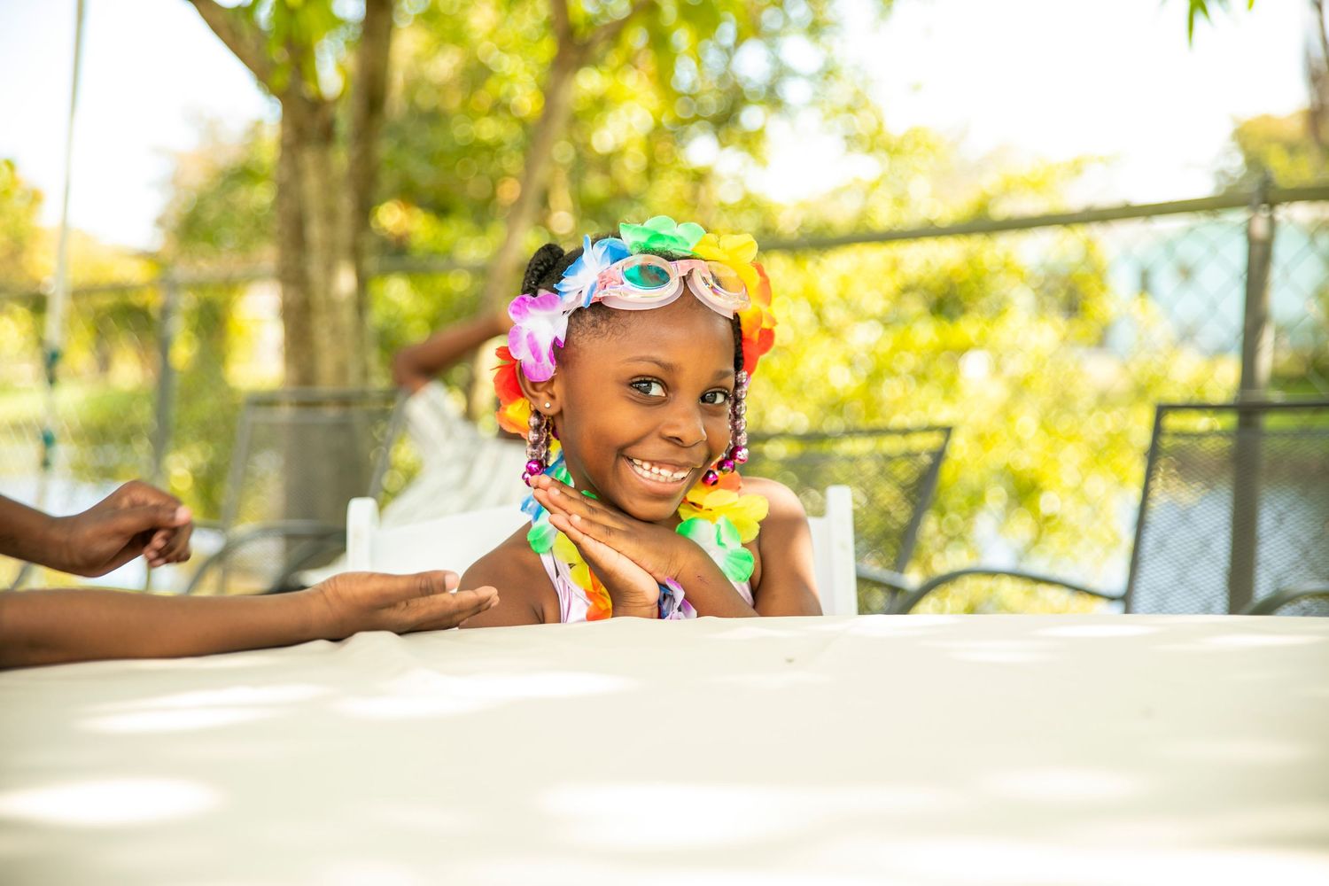 Happy child captured during a colorful outdoor birthday photography session
