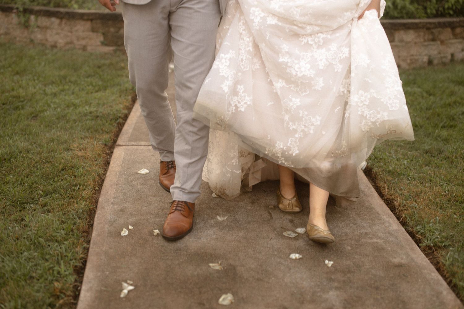 a bride and groom walking down the aisle after getting married